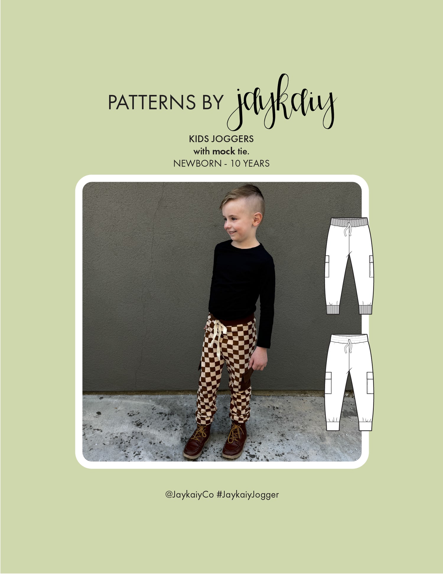 Kid's Jogger sewing pattern with optional pockets and mock-tie. Sizes newborn to 10 years. Beginner friendly. The cover images shows a 6-year old boy wearing a pair of cream and brown checkered jogggers with solid brown pocket, waistband and cuffs. A white mock-tie on the front.